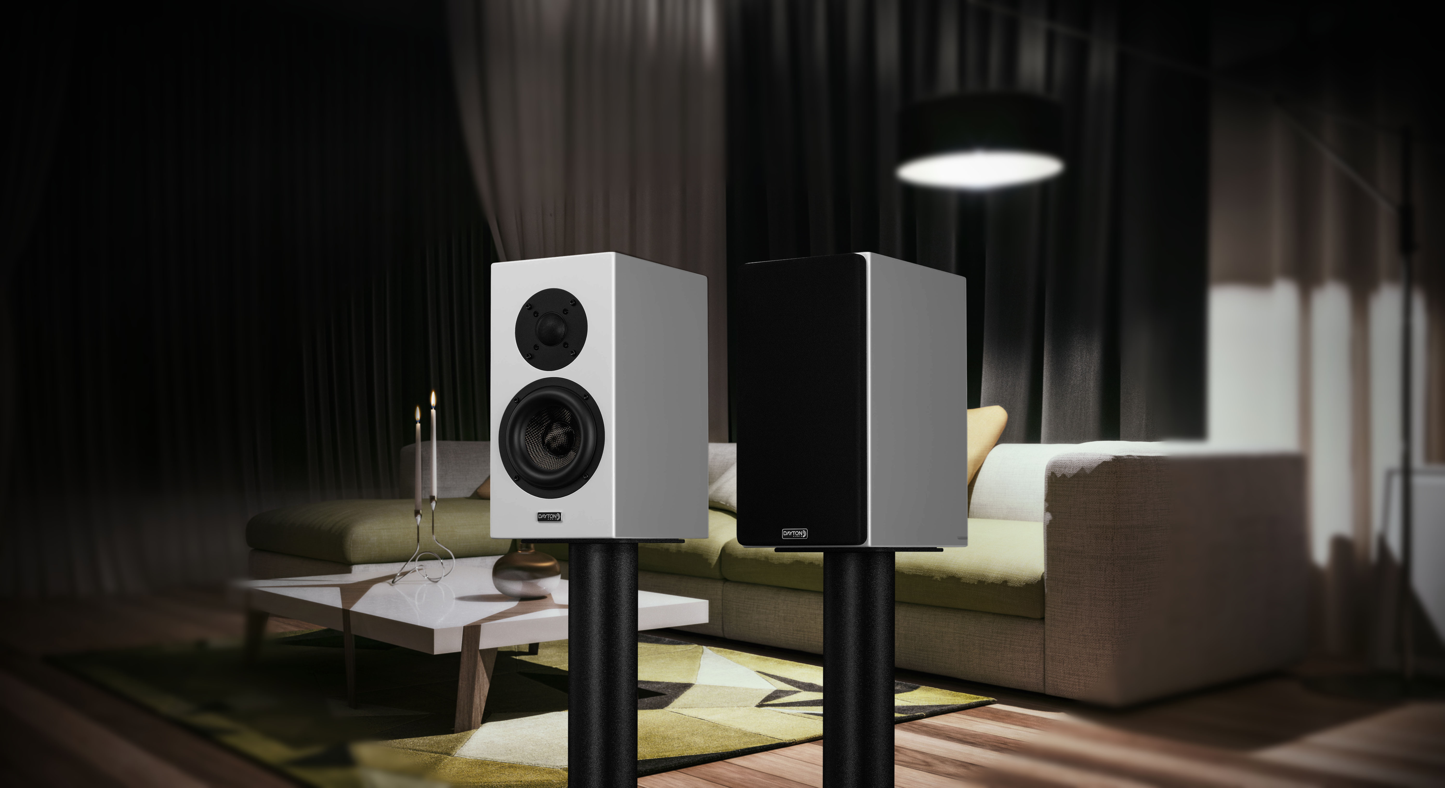 The black OPAL1 speakers *ONLY SOLD IN PAIRS* in a livingroom background