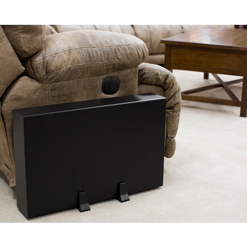 subwoofer behind couch